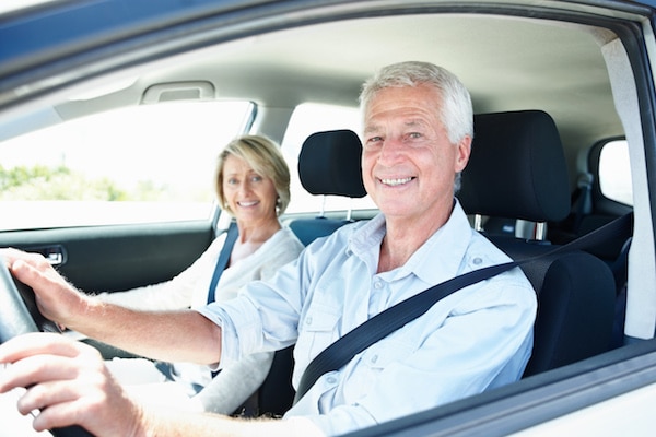 Hearing loss affects romance Happy older couple driving a car