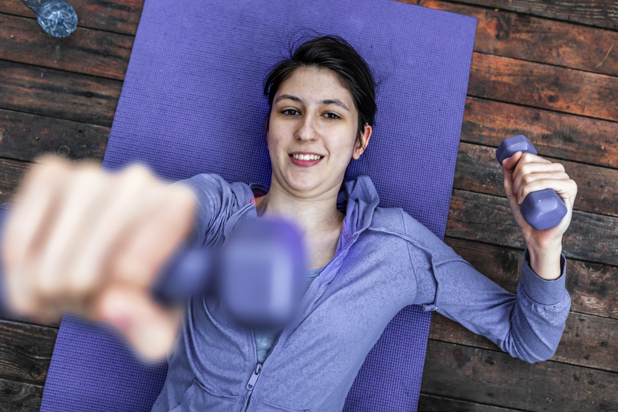 Woman exercises with weights