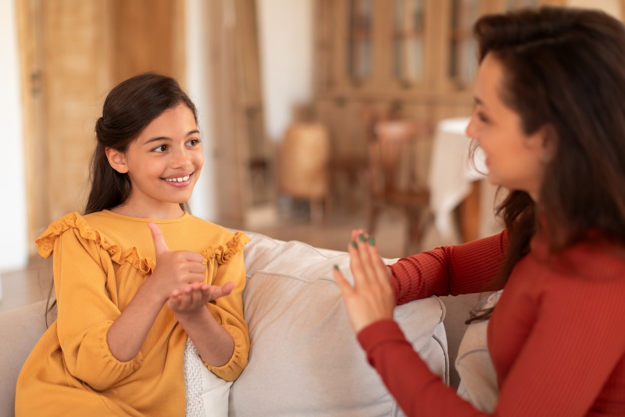 Young girl practices sign language